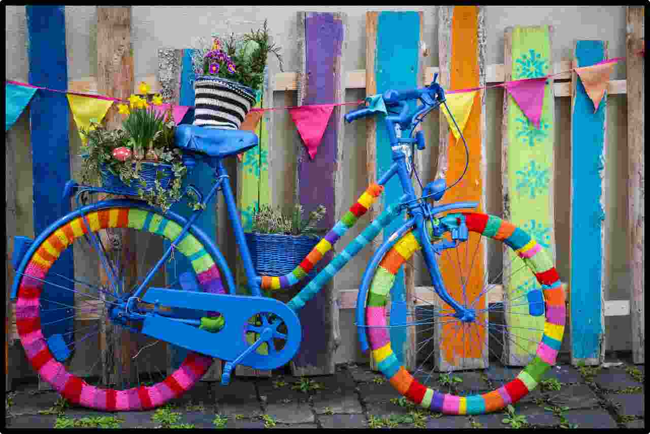 Colorfully painted bicycles on vibrant display for all to see.